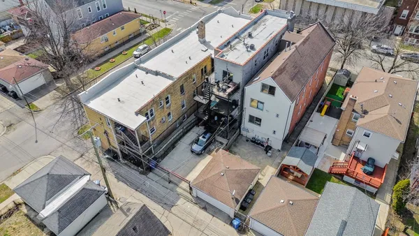 an aerial view of a house with outdoor space