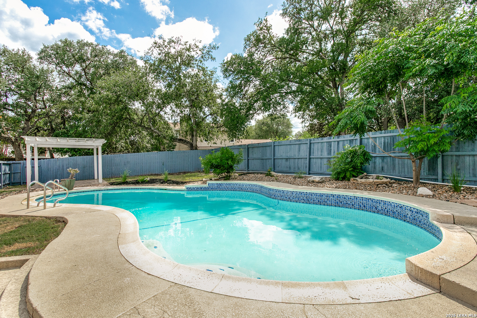 102 Silver Spring Universal City, TX 78148 - Photo 31 of 36 a swimming pool with outdoor seating and yard