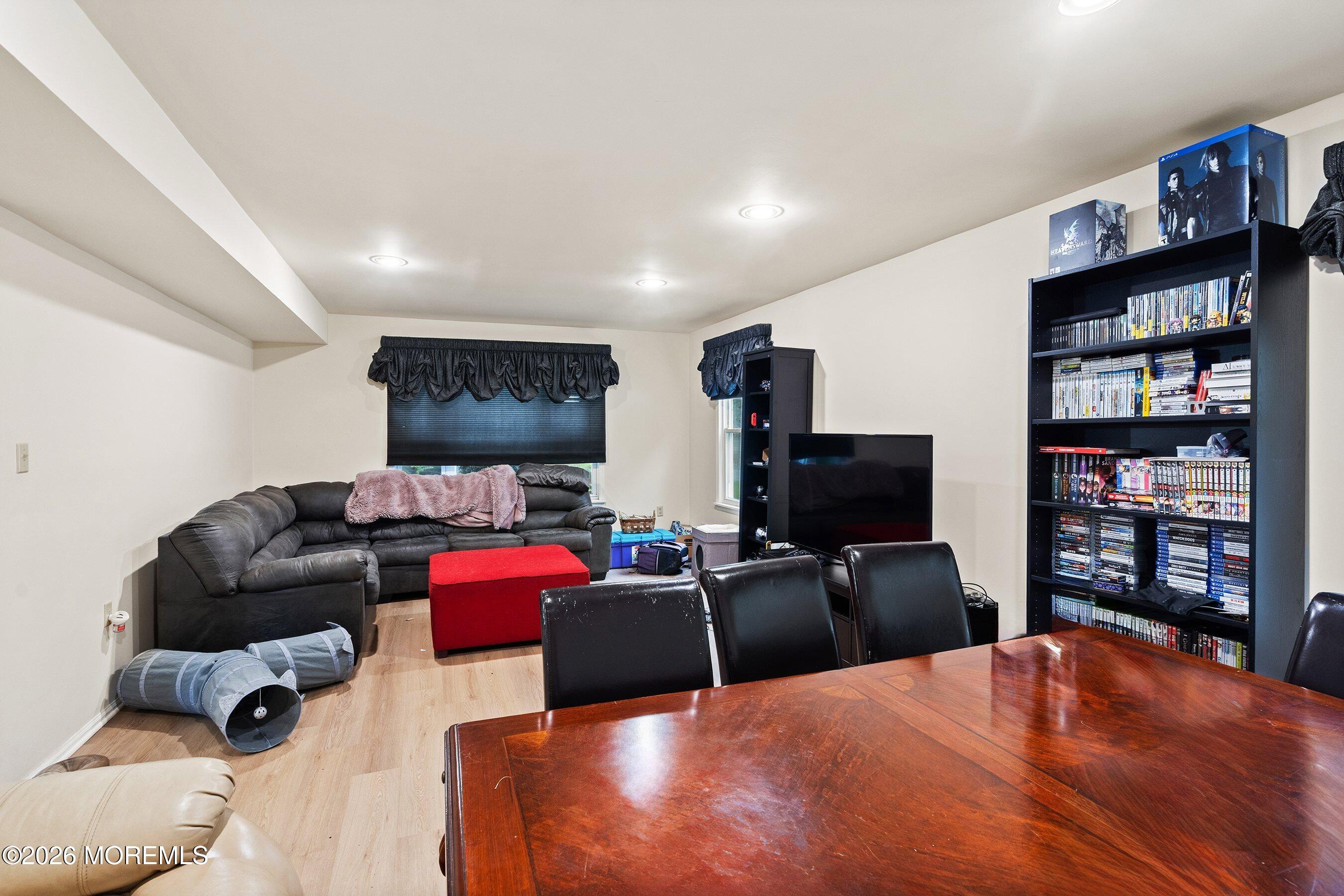 47 Sweet Gum Road Howell, NJ 07731 - Photo 4 of 27 a living room with furniture and a flat screen tv
