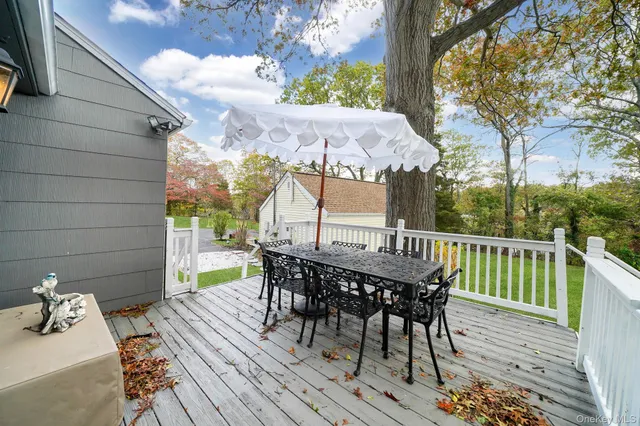 a view of a chairs and table on the deck