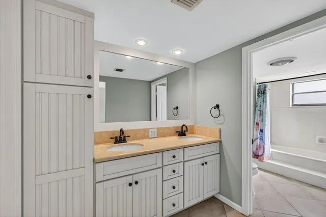 a bathroom with a shower and a bath tub