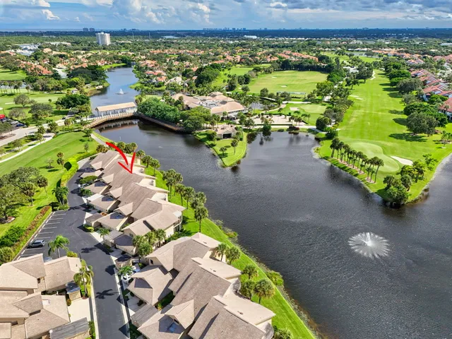 an aerial view of a house with a lake view