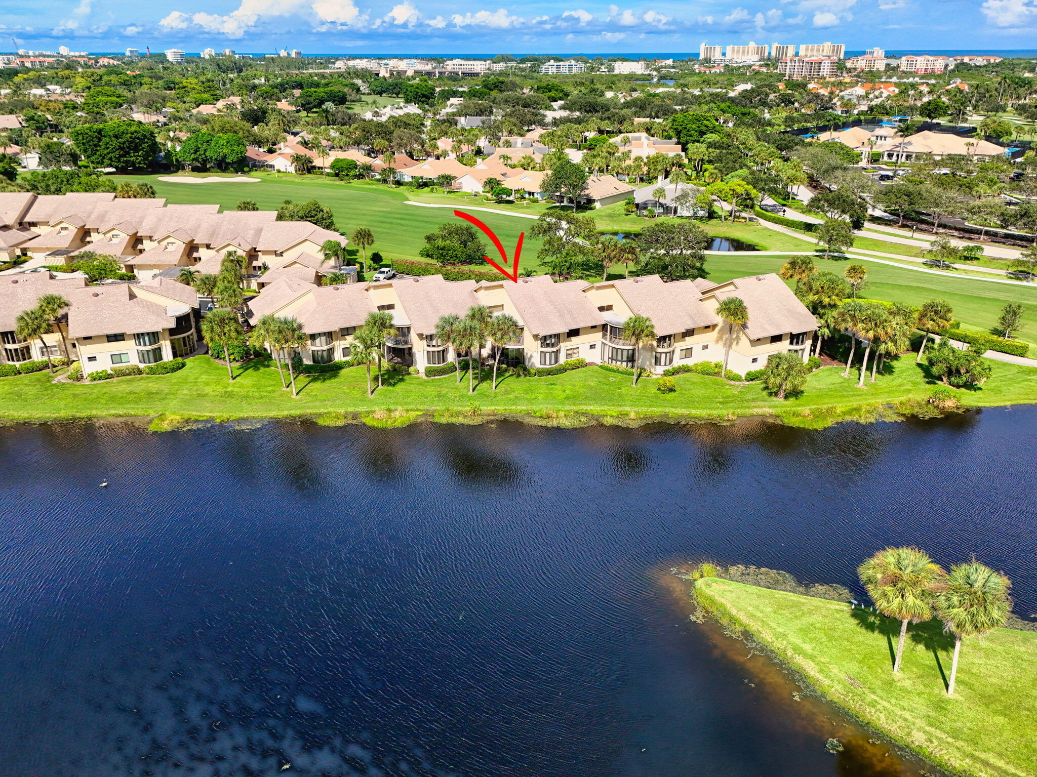 16885 Waterbend Drive, Unit 175 Jupiter, FL 33477 - Photo 41 of 43 a view of a lake with a houses