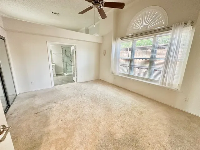 an empty room with a window and outdoor view