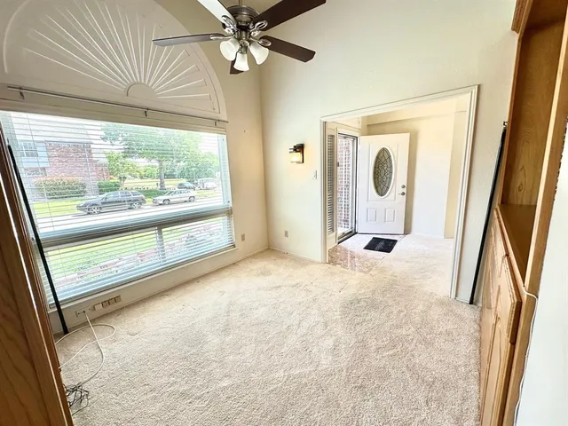 a view of a hallway with a large window