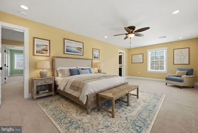 a view of a house with wooden fence