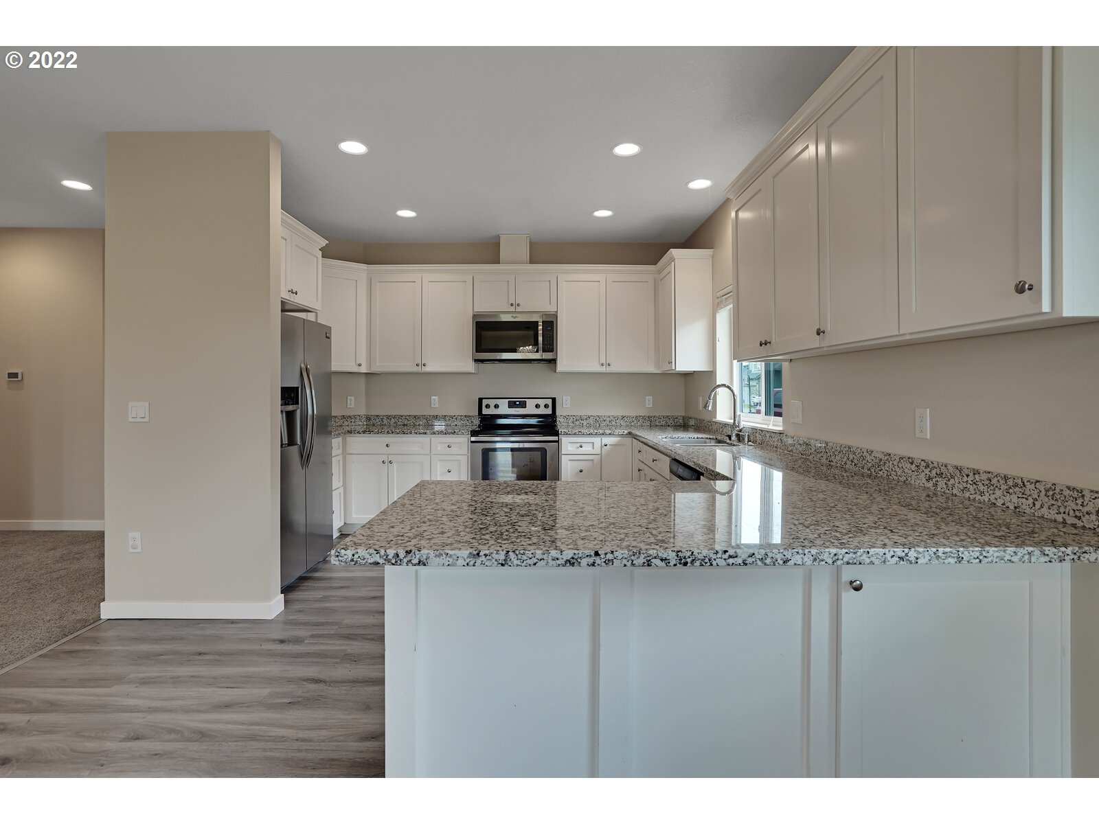 542 East Elm Loop Gervais, OR 97026 - Photo 16 of 32 a kitchen with stainless steel appliances granite countertop a sink refrigerator and cabinets