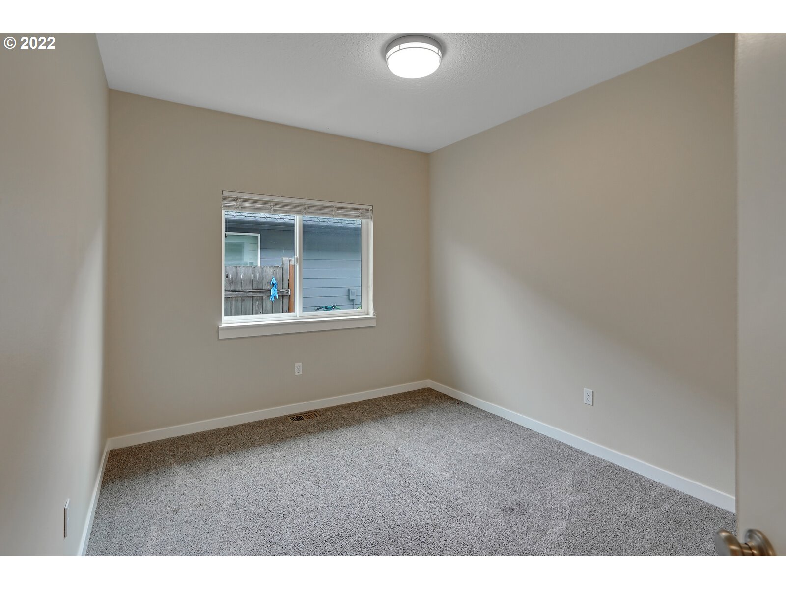 542 East Elm Loop Gervais, OR 97026 - Photo 21 of 32 a view of an empty room with a window