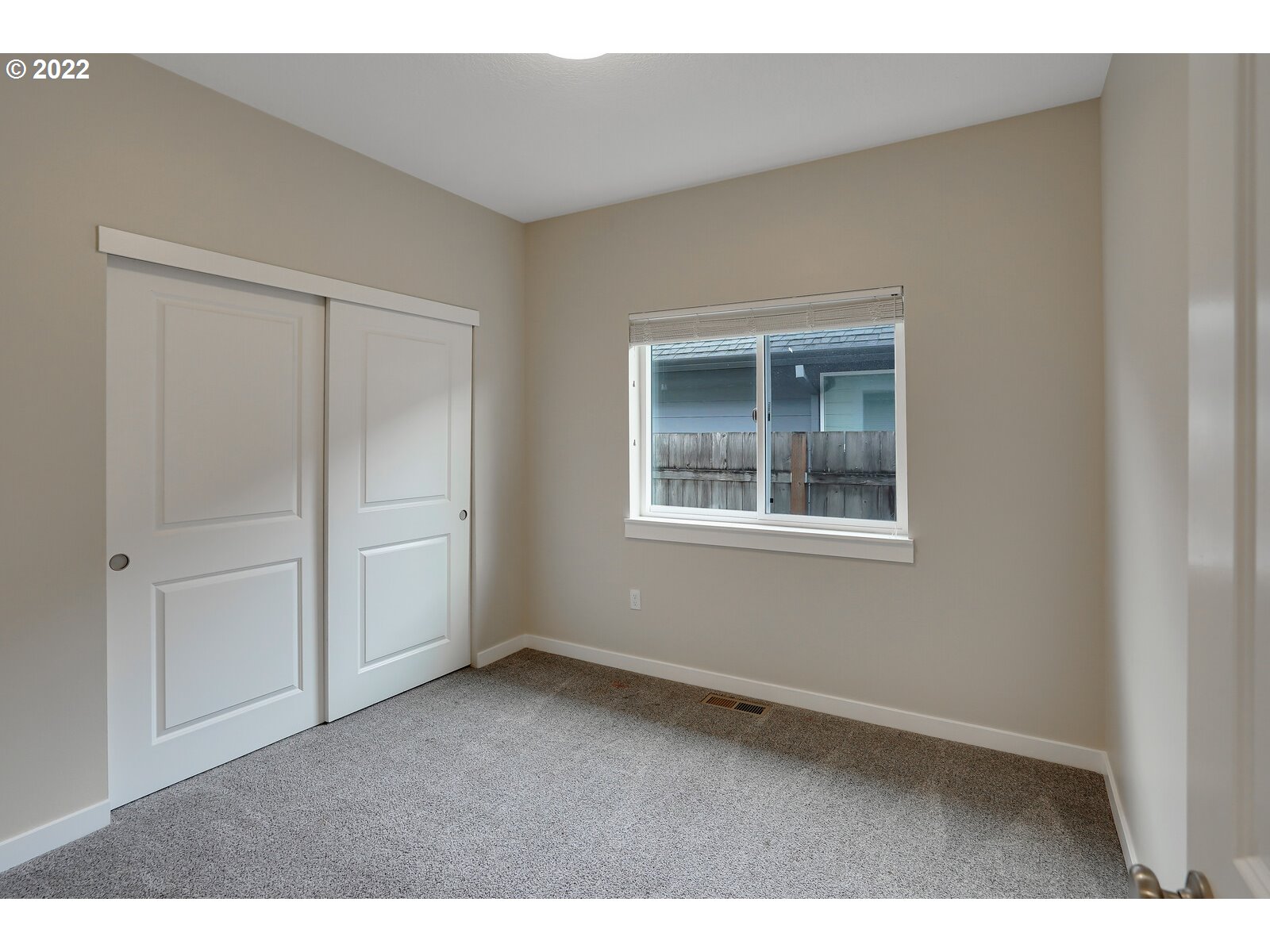 542 East Elm Loop Gervais, OR 97026 - Photo 23 of 32 an empty room with windows and closet