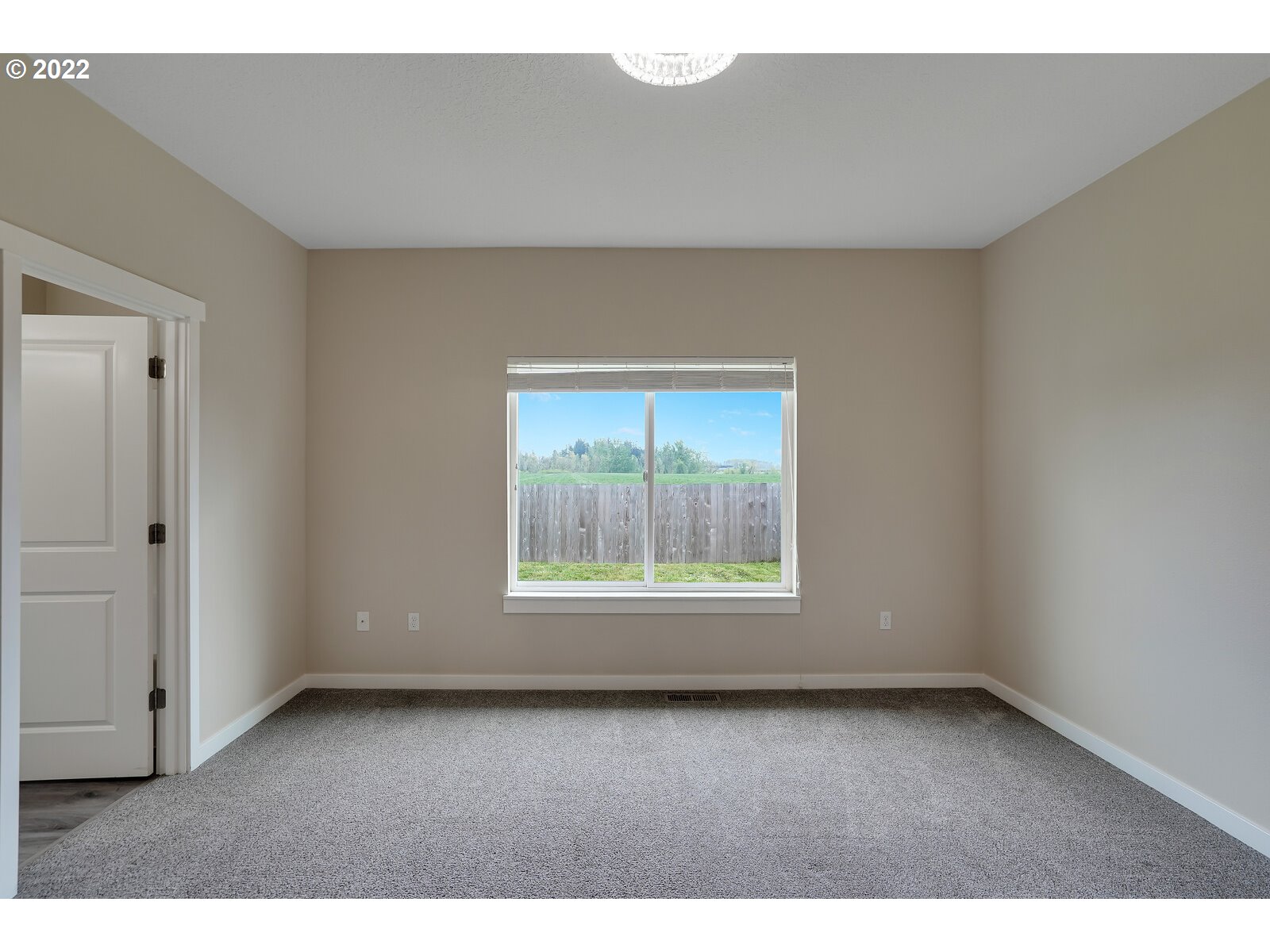 542 East Elm Loop Gervais, OR 97026 - Photo 26 of 32 a view of an empty room with a window