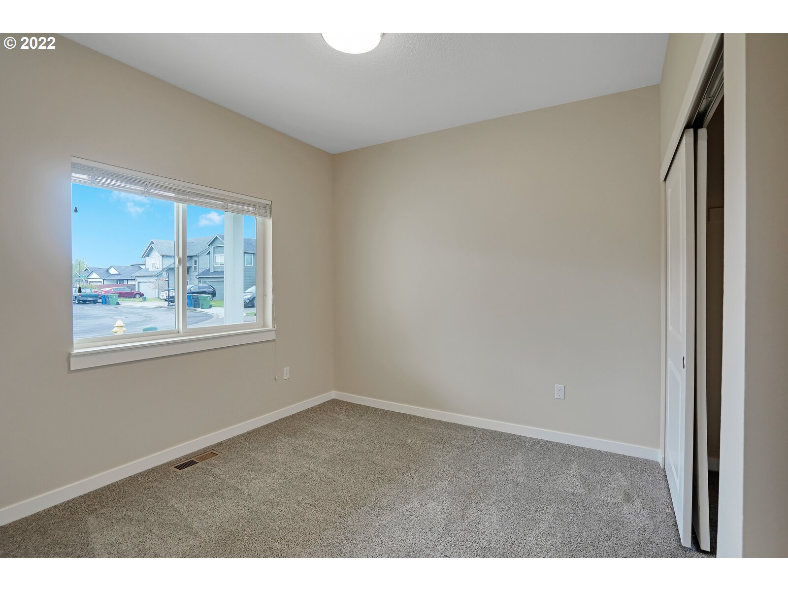 542 East Elm Loop Gervais, OR 97026 - Photo 7 of 32 a view of an empty room with a window