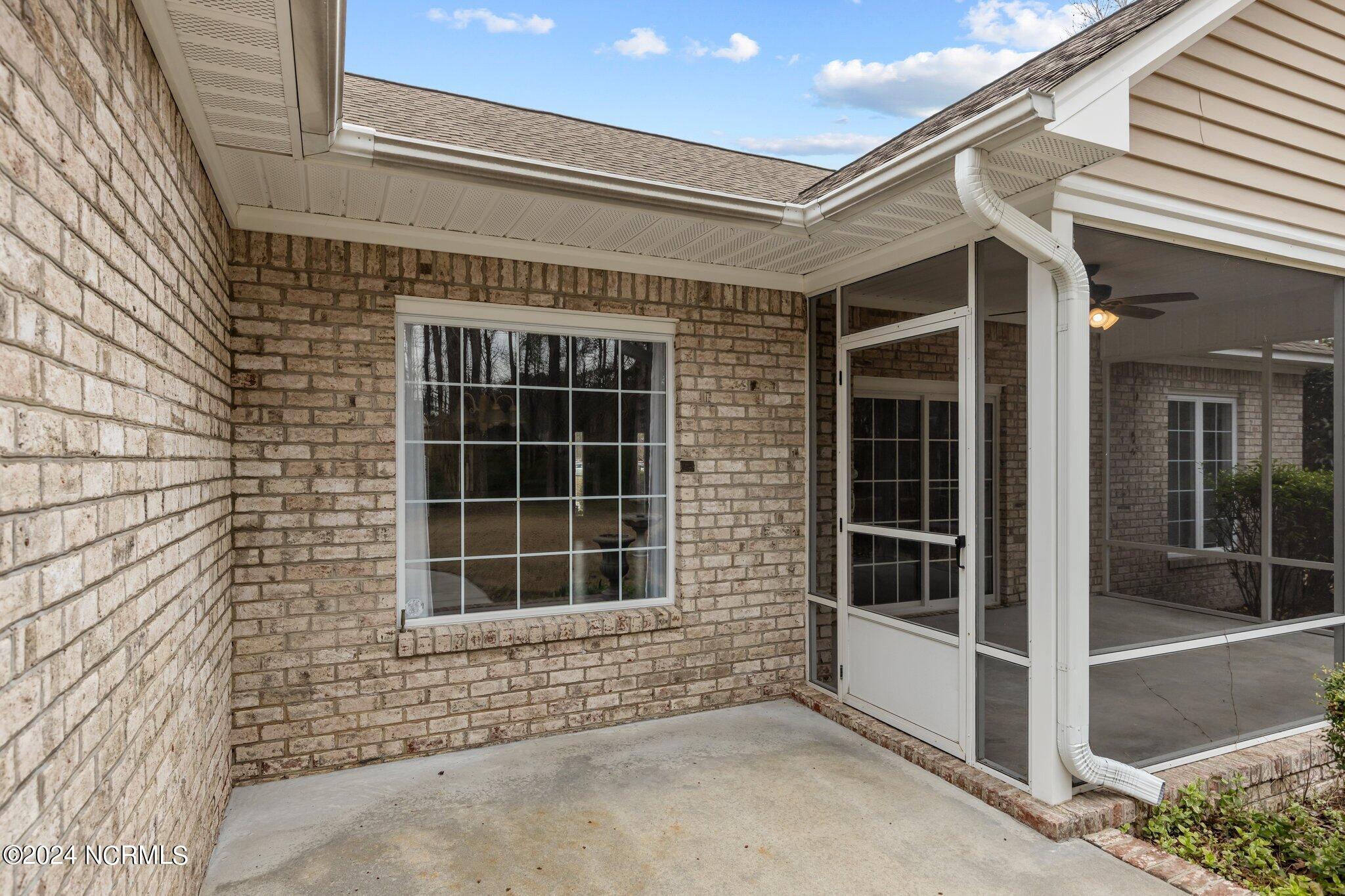 126 Neuchatel Road New Bern, NC 28562 - Photo 54 of 71 Patio located off rear screened porch