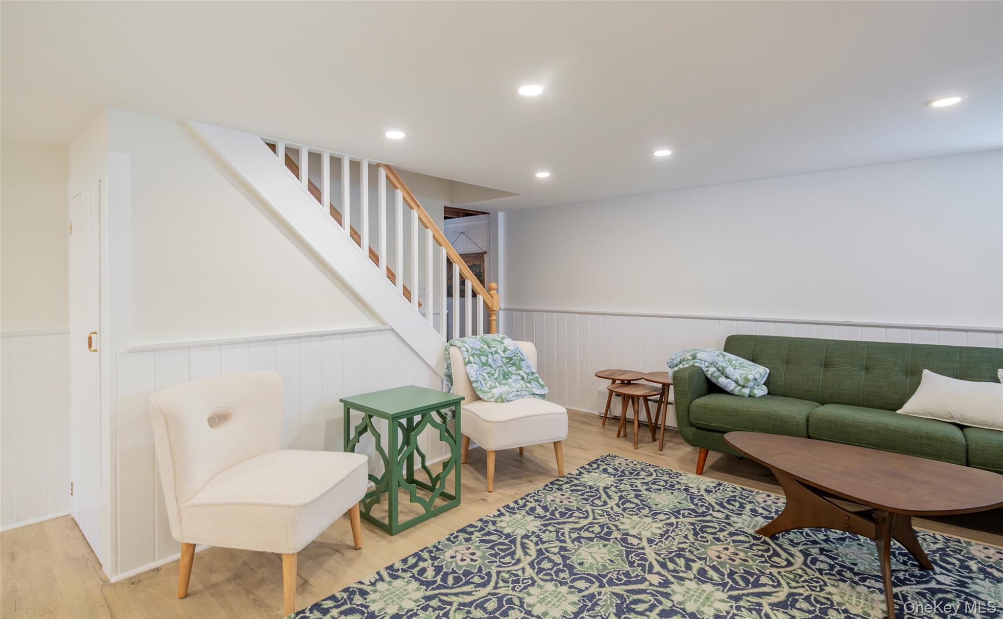 275 Maier Place Southold, NY 11971 - Photo 13 of 27 a living room with furniture and a wooden floor