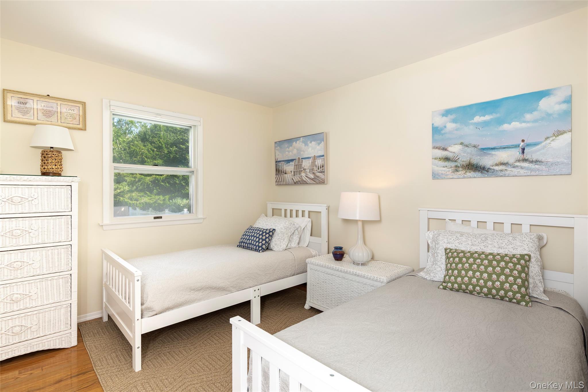 275 Maier Place Southold, NY 11971 - Photo 20 of 27 a bedroom with a bed and a large window