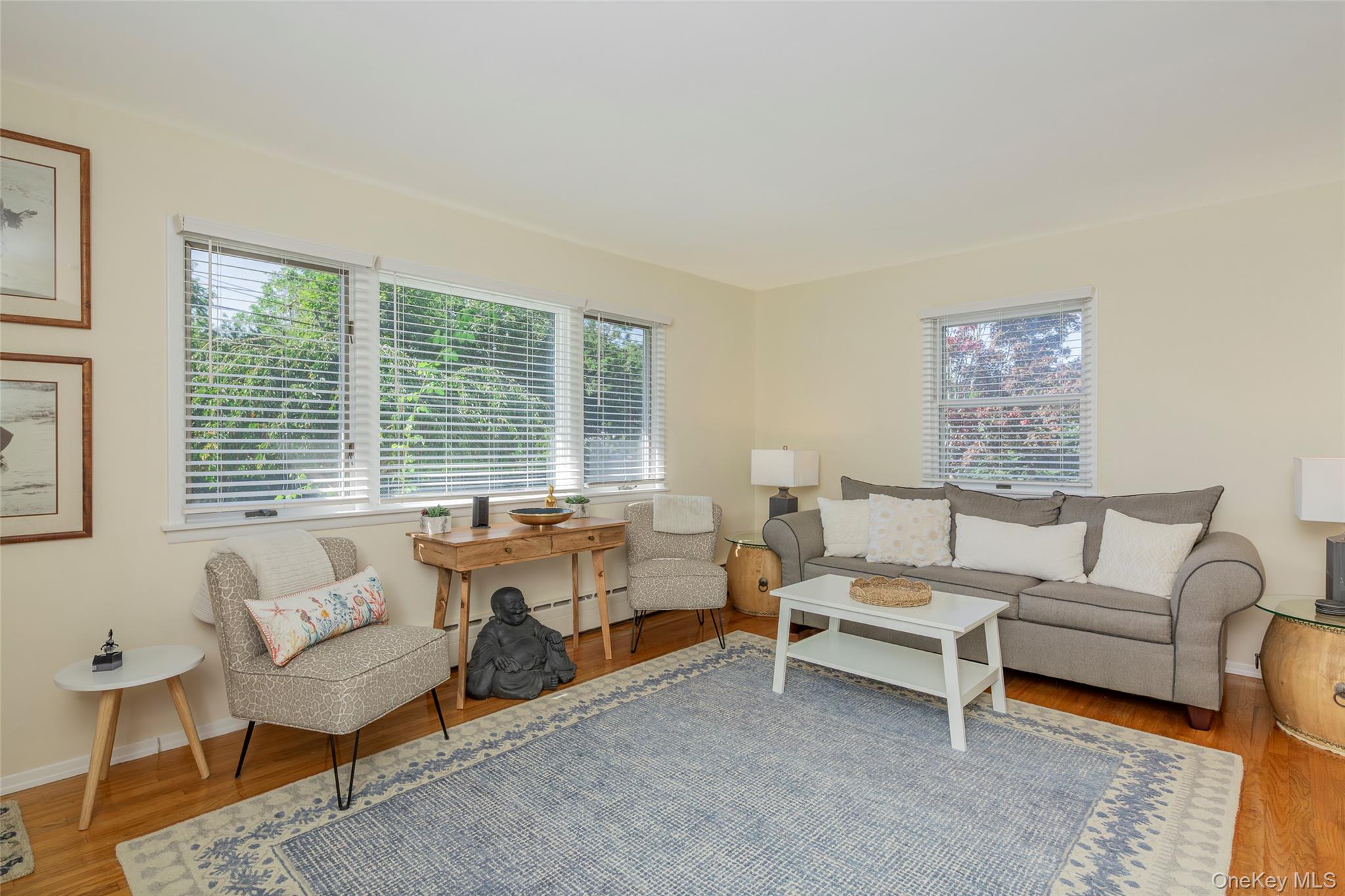 275 Maier Place Southold, NY 11971 - Photo 24 of 27 a living room with furniture and a large window