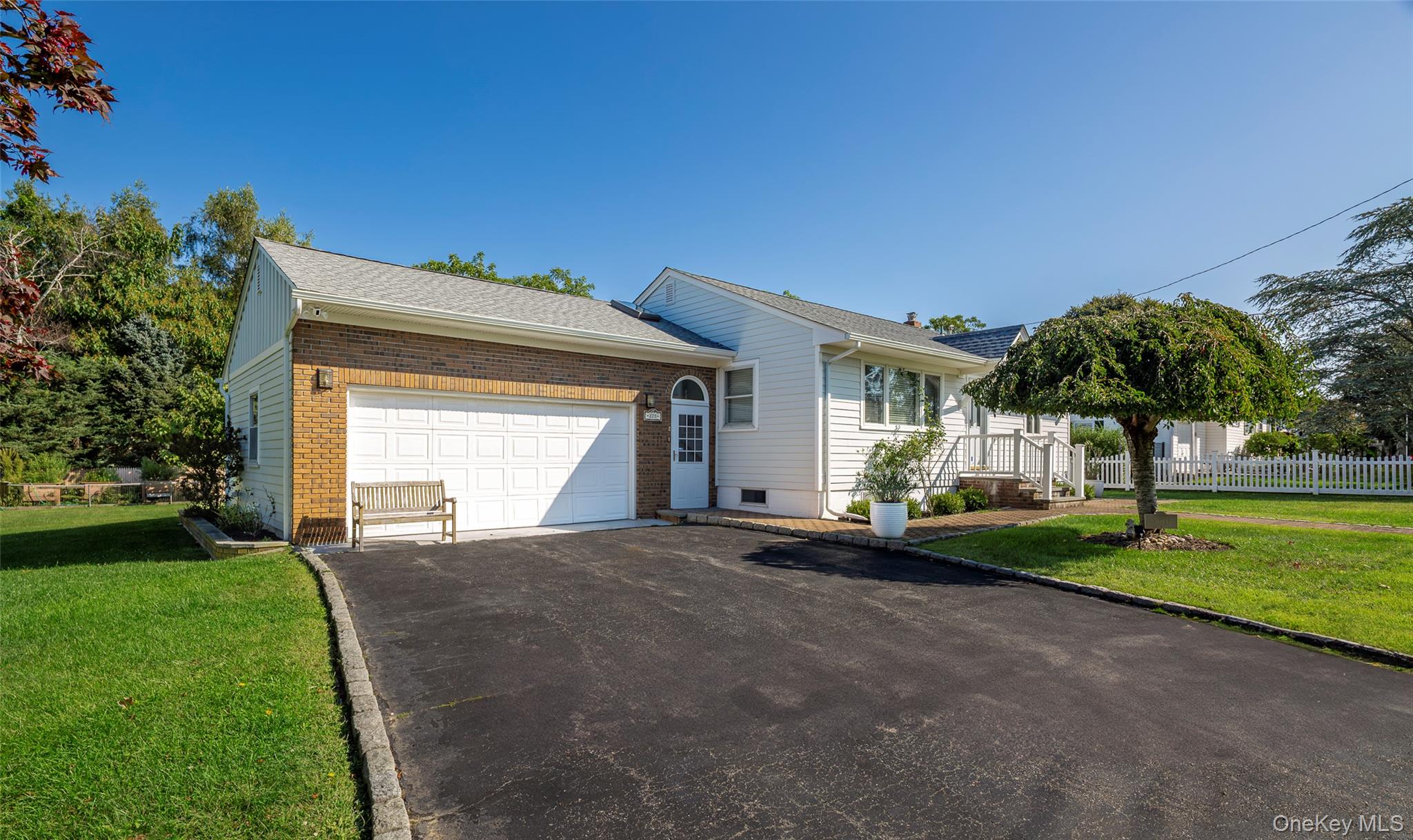 275 Maier Place Southold, NY 11971 - Photo 27 of 27 a view of a house with a yard and potted plants