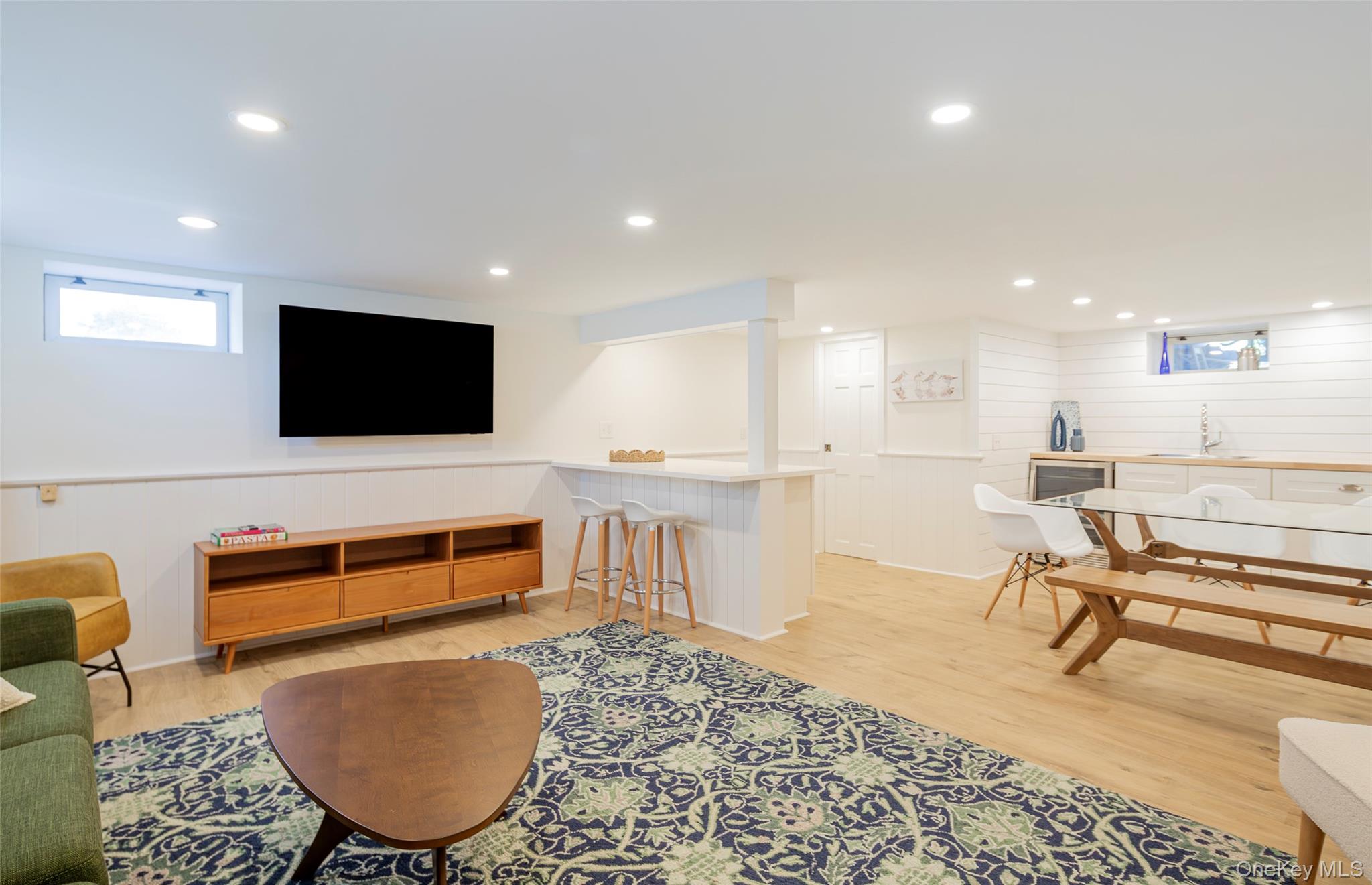275 Maier Place Southold, NY 11971 - Photo 10 of 27 a living room with furniture pool table and a flat screen tv