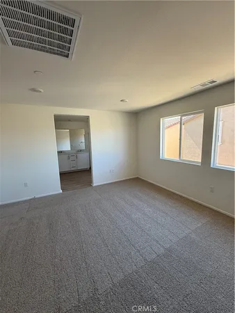 an empty room with windows