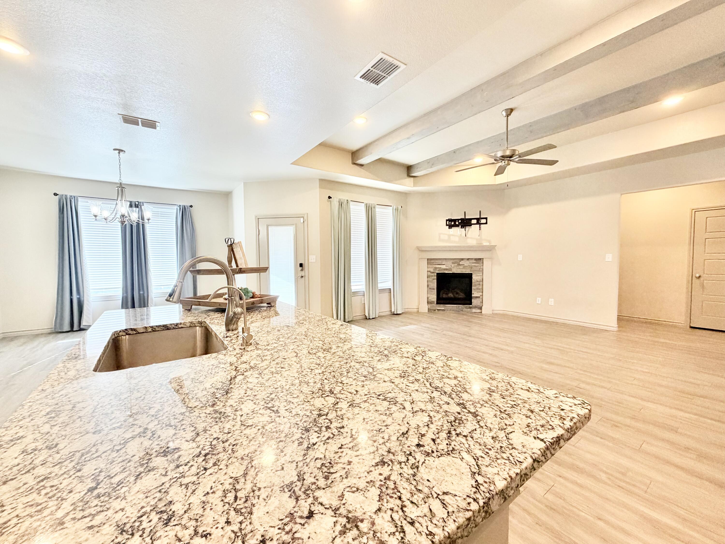 7611 61st Street Lubbock, TX 79407 - Photo 11 of 31 a bathroom with a sink double vanity and a tub