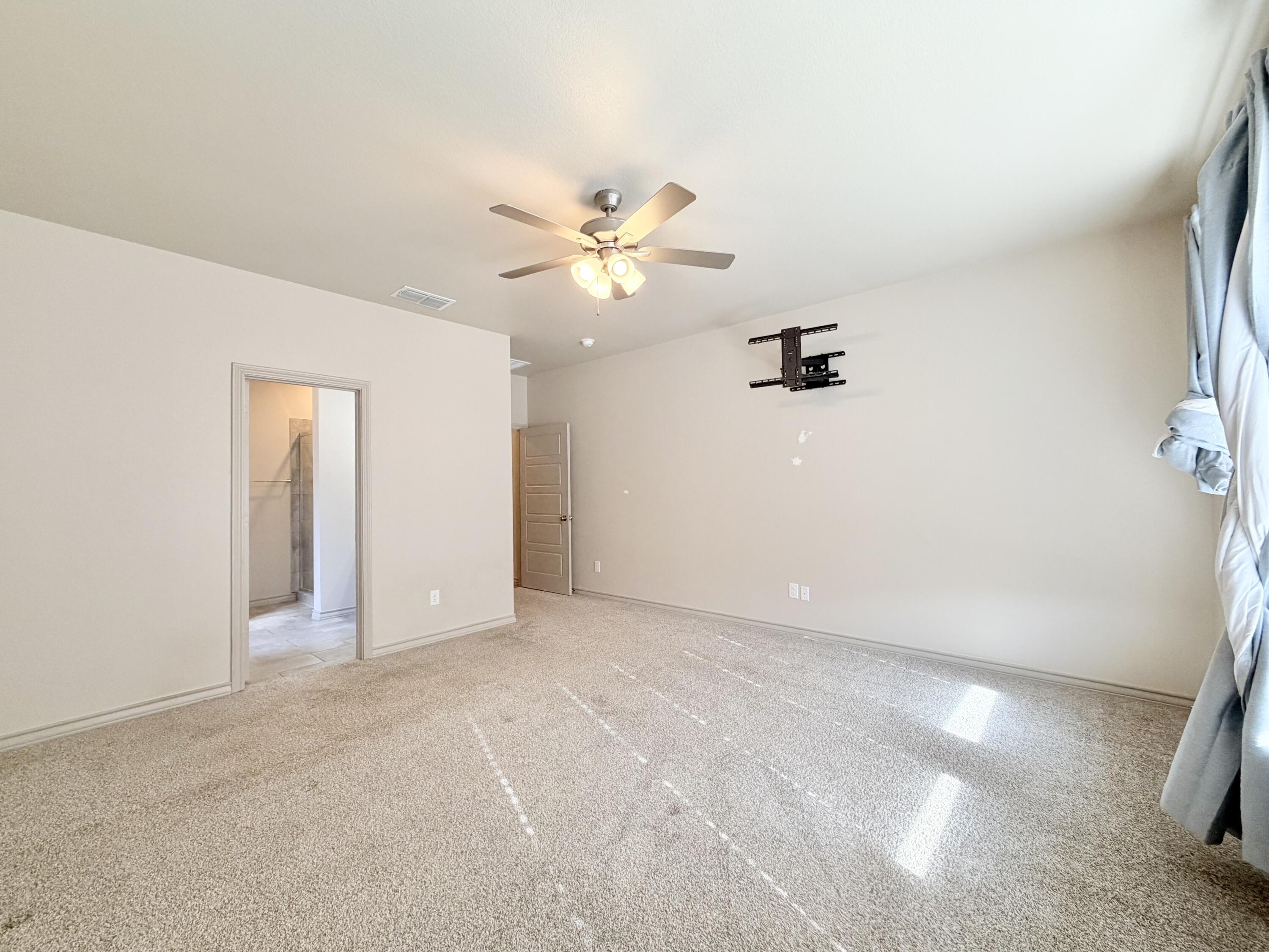 7611 61st Street Lubbock, TX 79407 - Photo 18 of 31 wooden floor in an empty room