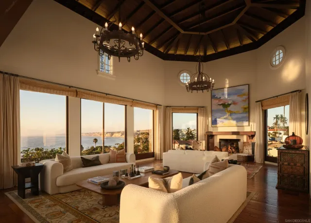 a living room with furniture and a chandelier