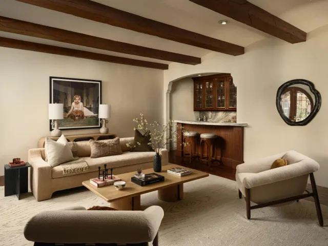 a kitchen with a dining table chairs cabinets and stainless steel appliances