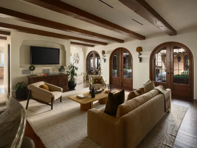 a kitchen with kitchen island granite countertop a sink and a stove