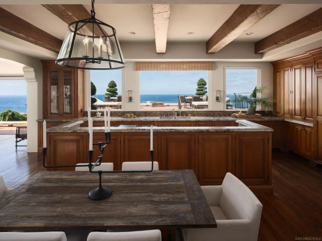 a bedroom with bed and a large window