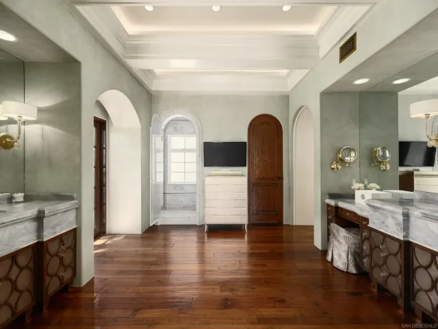 a bedroom with a large bed and a large window