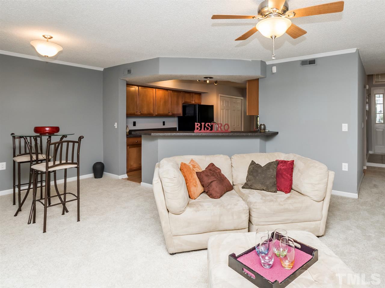 7706 Falcon Rest Circle, Unit N/A Raleigh, NC 27615 - Photo 3 of 19 a living room with furniture and a flat screen tv