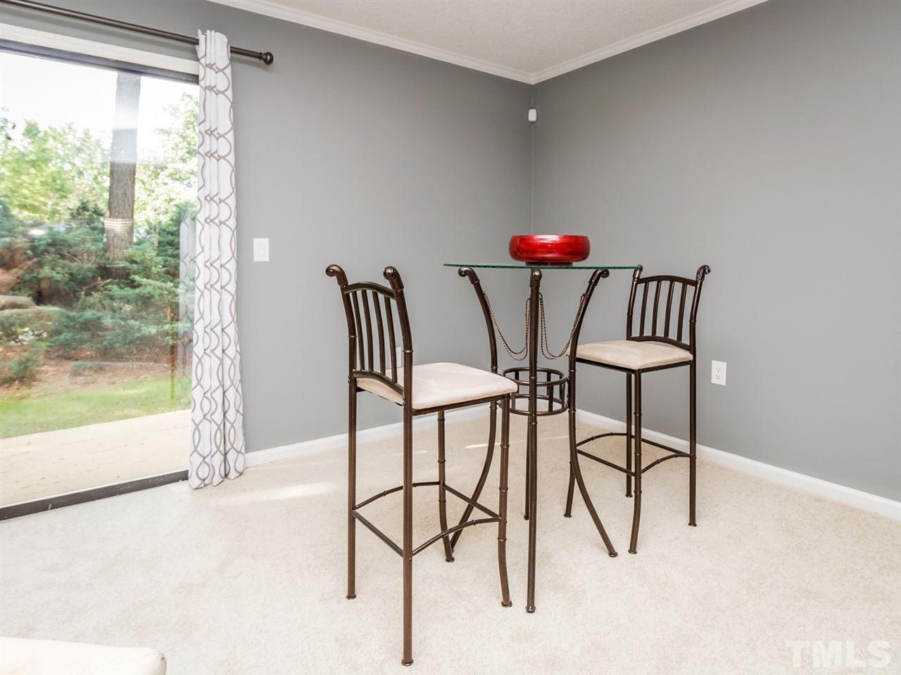 7706 Falcon Rest Circle, Unit N/A Raleigh, NC 27615 - Photo 5 of 19 a view of a room with furniture and wooden floor