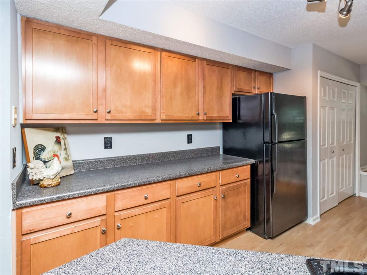 7706 Falcon Rest Circle, Unit N/A Raleigh, NC 27615 - Photo 8 of 19 a kitchen with stainless steel appliances granite countertop a refrigerator and a sink