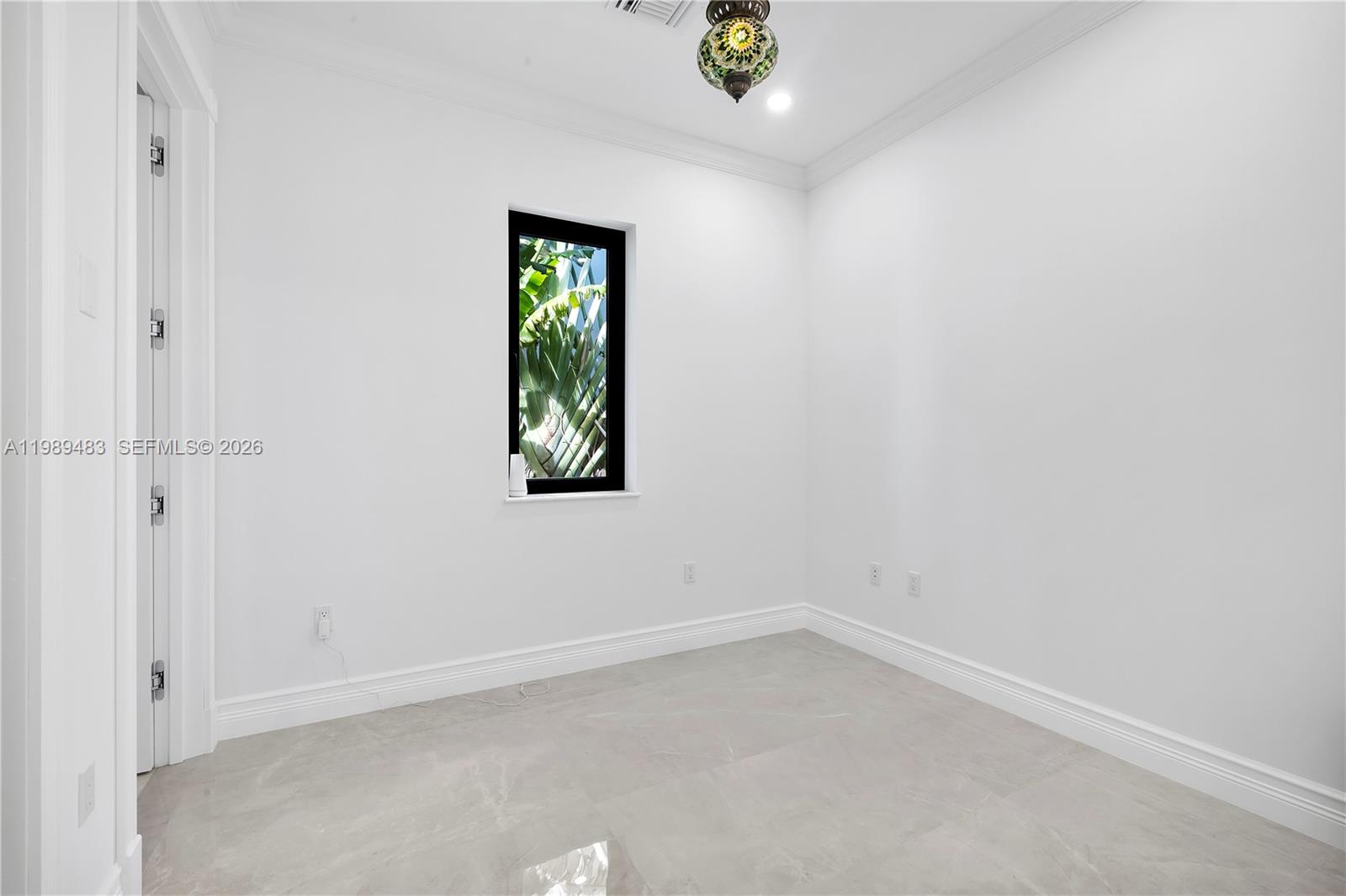 919 92nd Street Surfside, FL 33154 - Photo 28 of 74 an empty room with a window