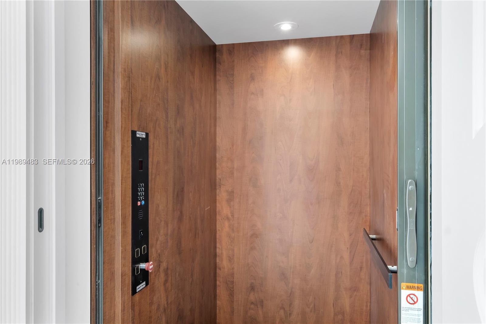 919 92nd Street Surfside, FL 33154 - Photo 32 of 74 a view of a hallway with a wooden door