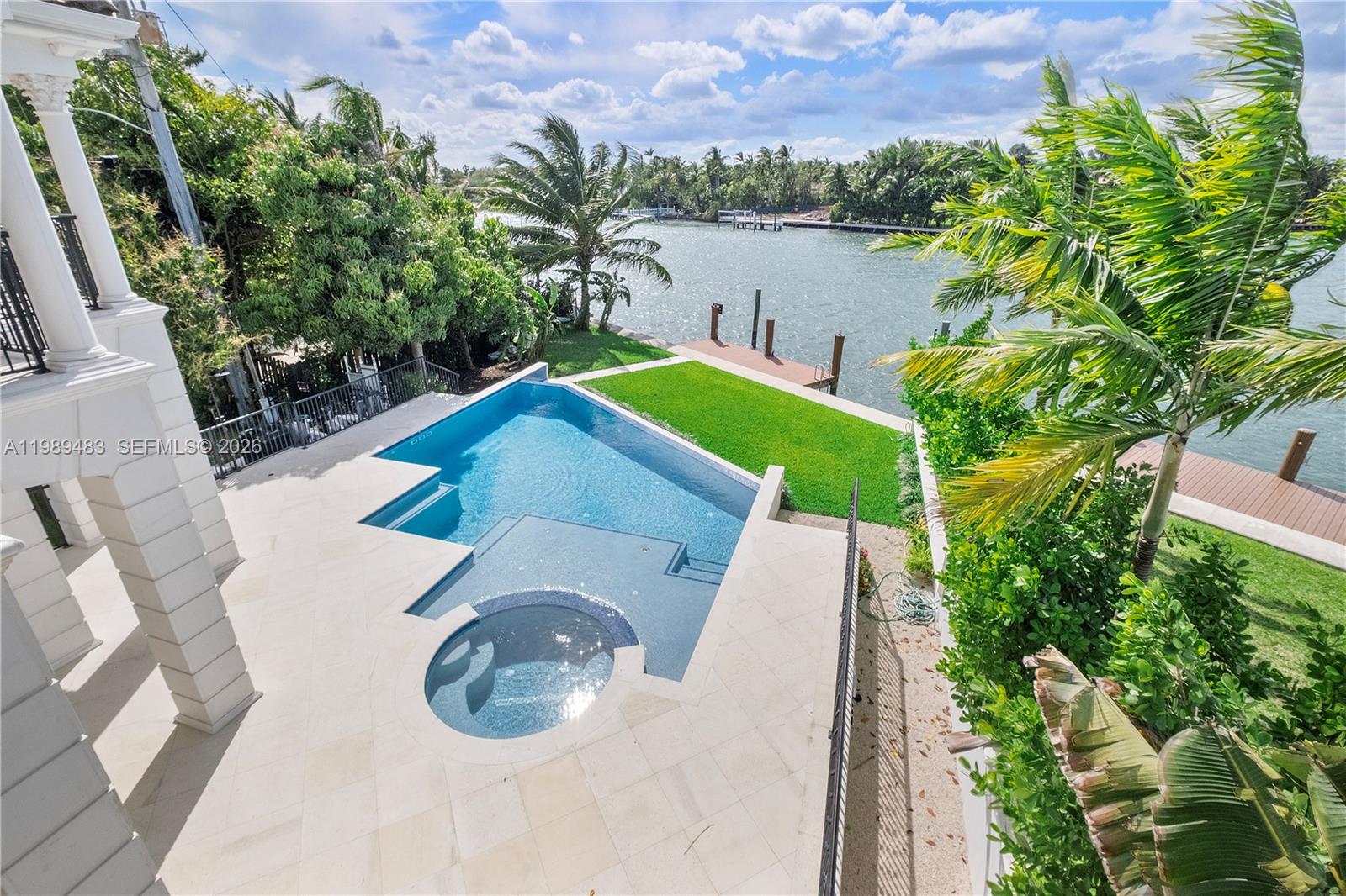 919 92nd Street Surfside, FL 33154 - Photo 44 of 74 a view of a backyard with plants and a lake view