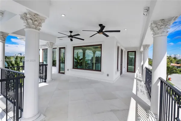 a view of a chandelier and dining table in a room