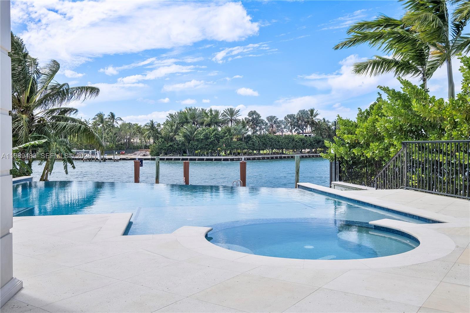 919 92nd Street Surfside, FL 33154 - Photo 58 of 74 a view of a swimming pool with a terrace