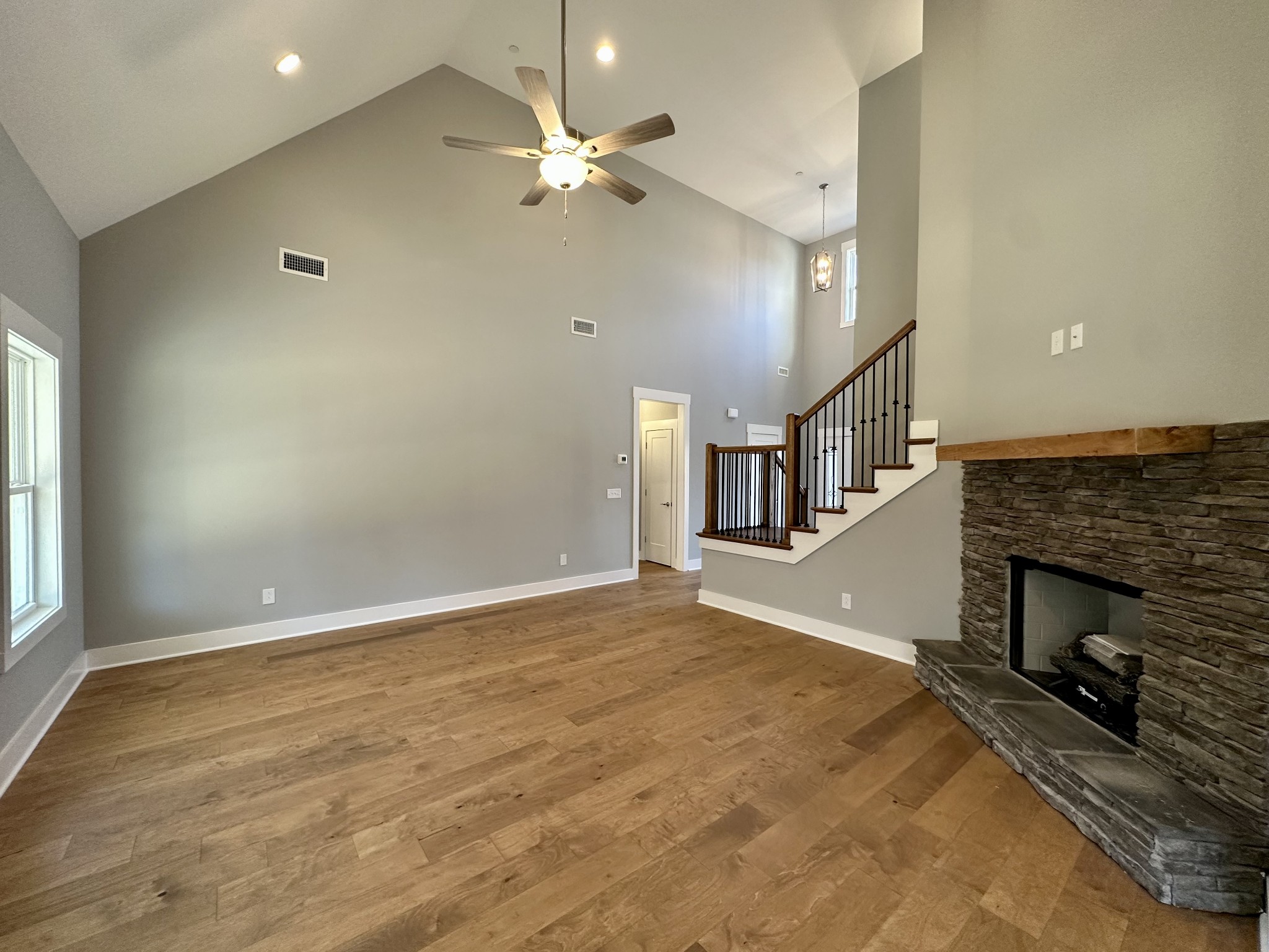 1212 White Rock Road Murfreesboro, TN 37129 - Photo 6 of 30 an empty room with fireplace and fan