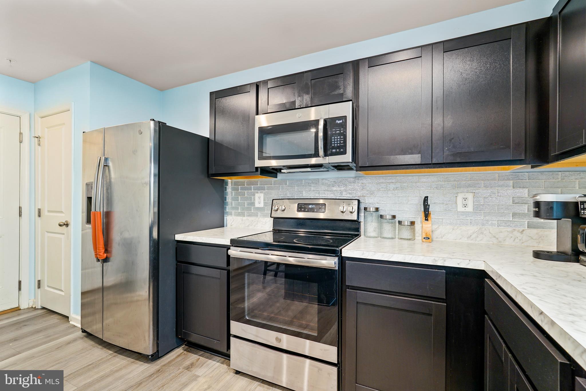 2 Ridgely Forest Drive Elkton, MD 21921 - Photo 14 of 54 a kitchen with granite countertop a refrigerator and a sink
