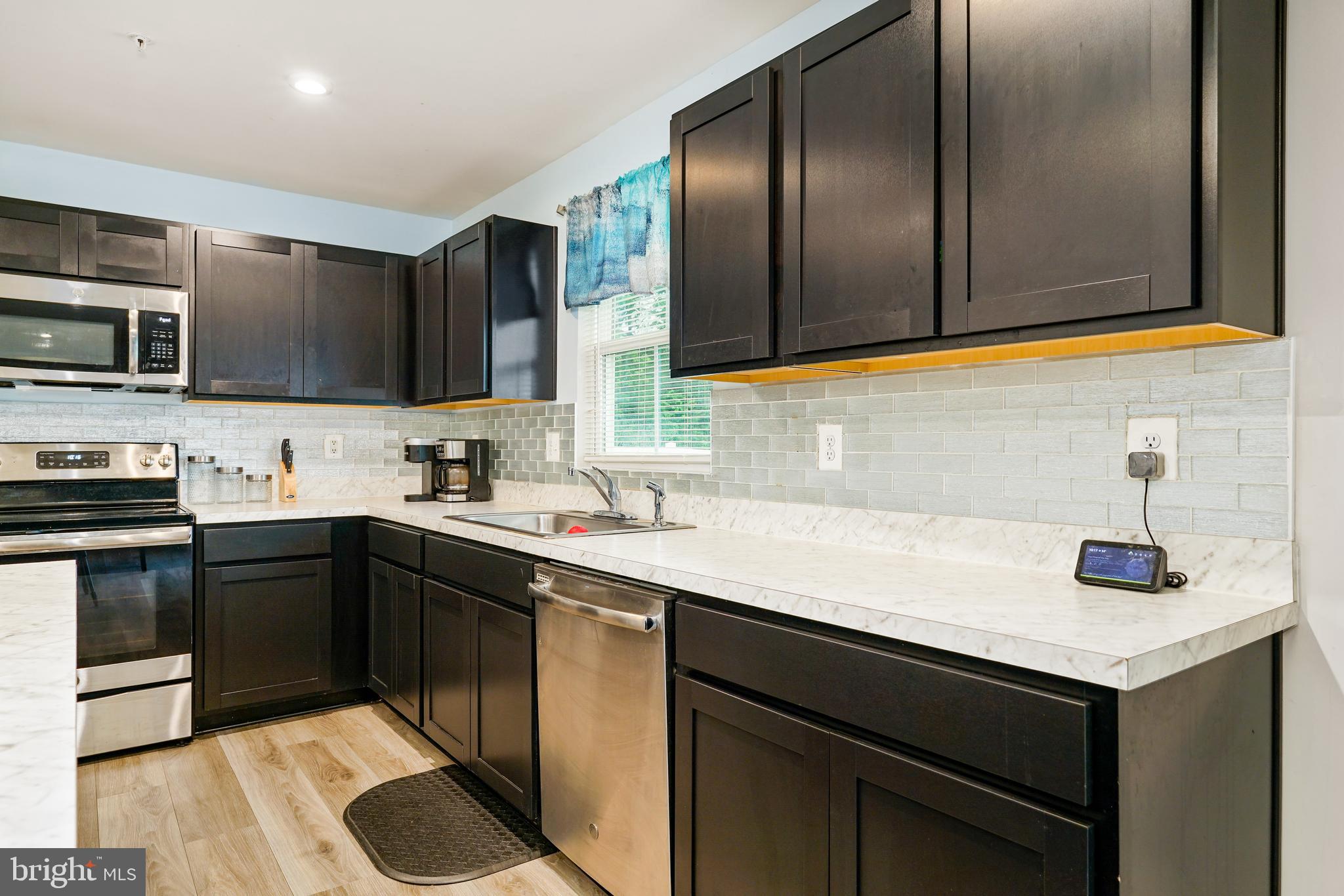 2 Ridgely Forest Drive Elkton, MD 21921 - Photo 19 of 54 a kitchen with a sink cabinets and stainless steel appliances