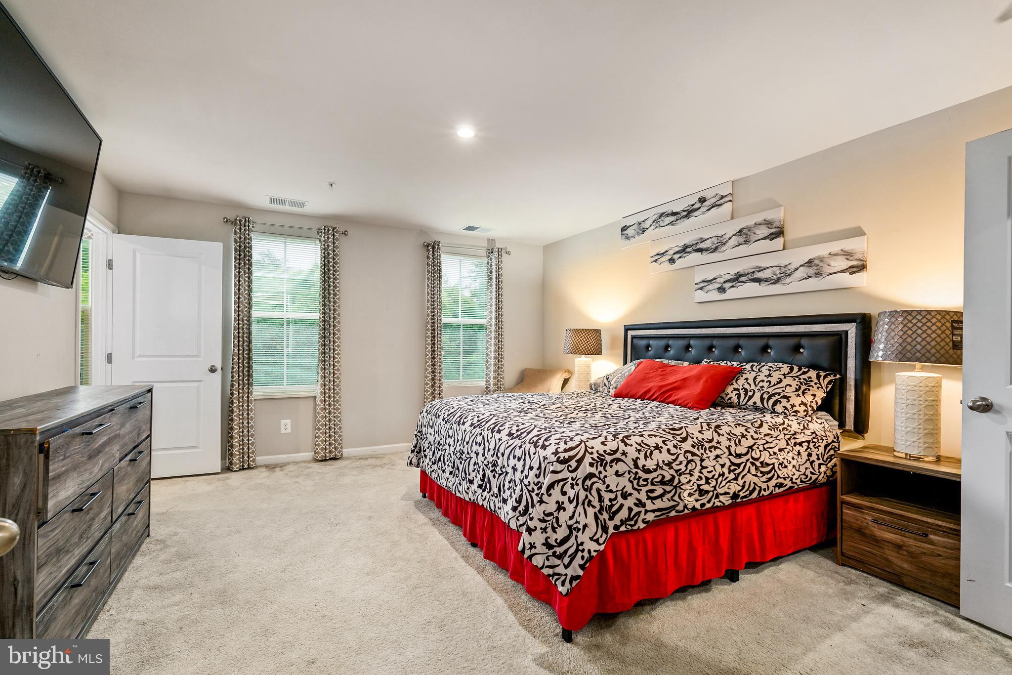 2 Ridgely Forest Drive Elkton, MD 21921 - Photo 20 of 54 a bedroom with a large bed and a tv