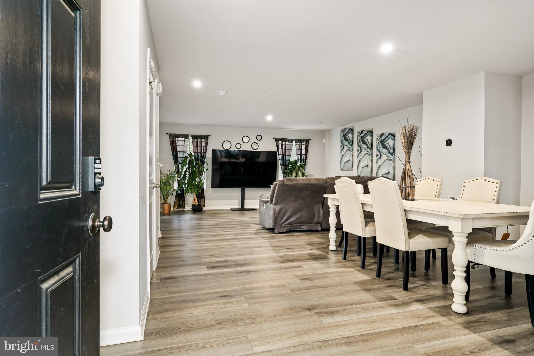 2 Ridgely Forest Drive Elkton, MD 21921 - Photo 2 of 54 a living room with furniture a dining table and kitchen view with wooden floor