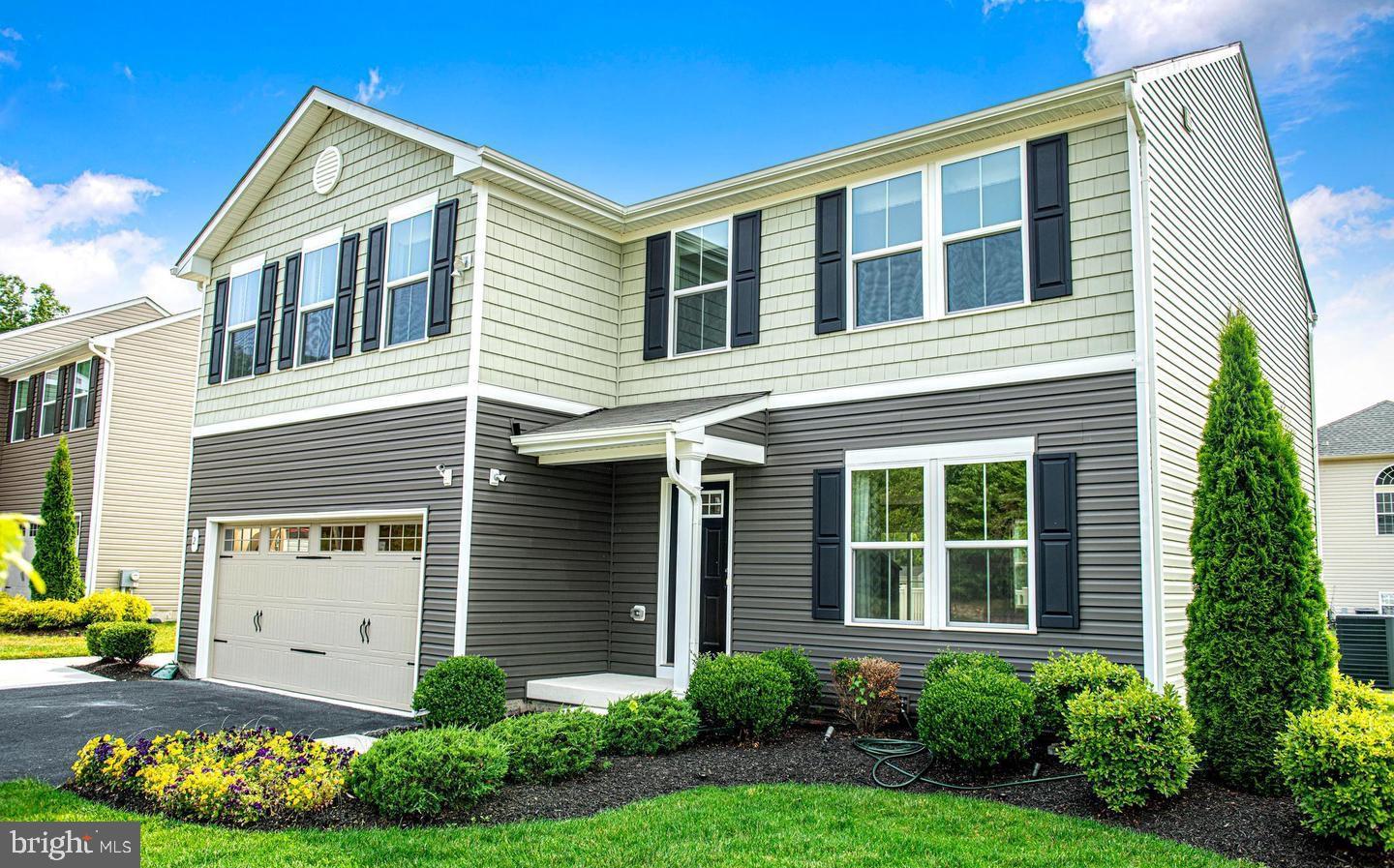 2 Ridgely Forest Drive Elkton, MD 21921 - Photo 37 of 54 a front view of a house with a yard and garage