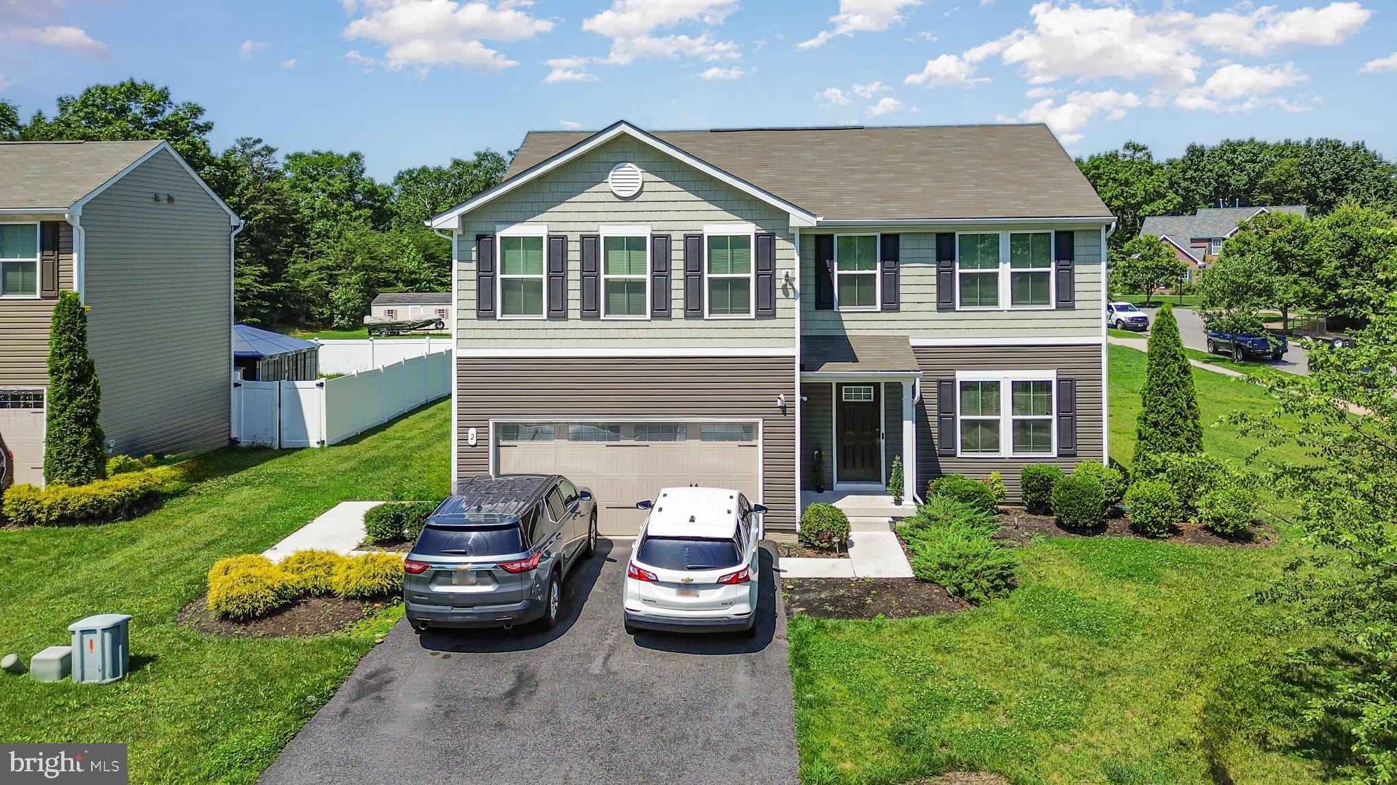 2 Ridgely Forest Drive Elkton, MD 21921 - Photo 38 of 54 a front view of a house with a garden and patio
