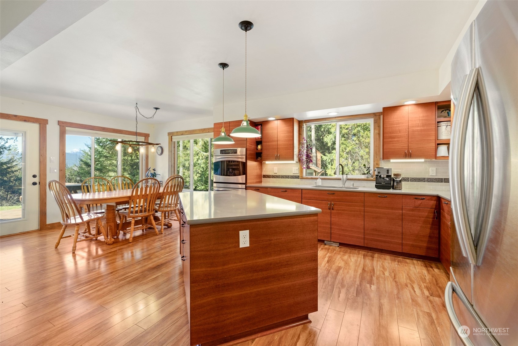 3956 Happy Valley Road Sequim, WA 98382 - Photo 14 of 40 a living room with furniture a wooden floor and a large window