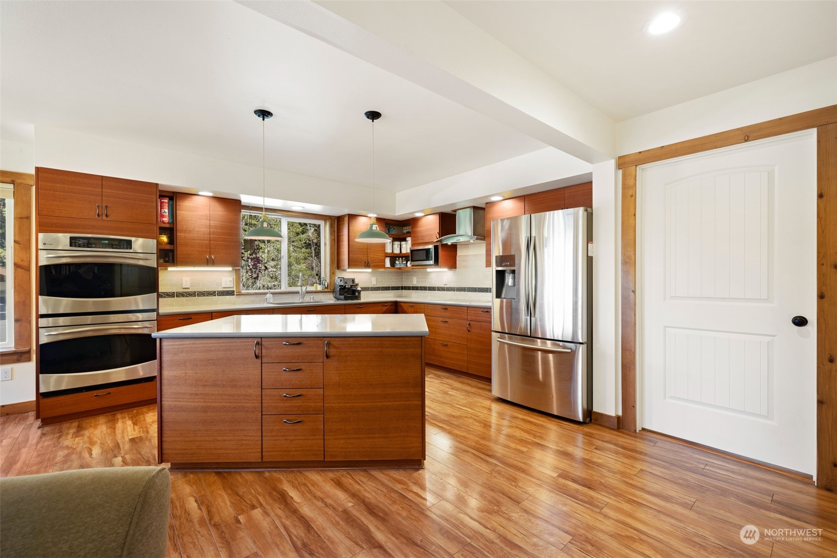 3956 Happy Valley Road Sequim, WA 98382 - Photo 15 of 40 a kitchen with stainless steel appliances granite countertop a refrigerator and a stove top oven