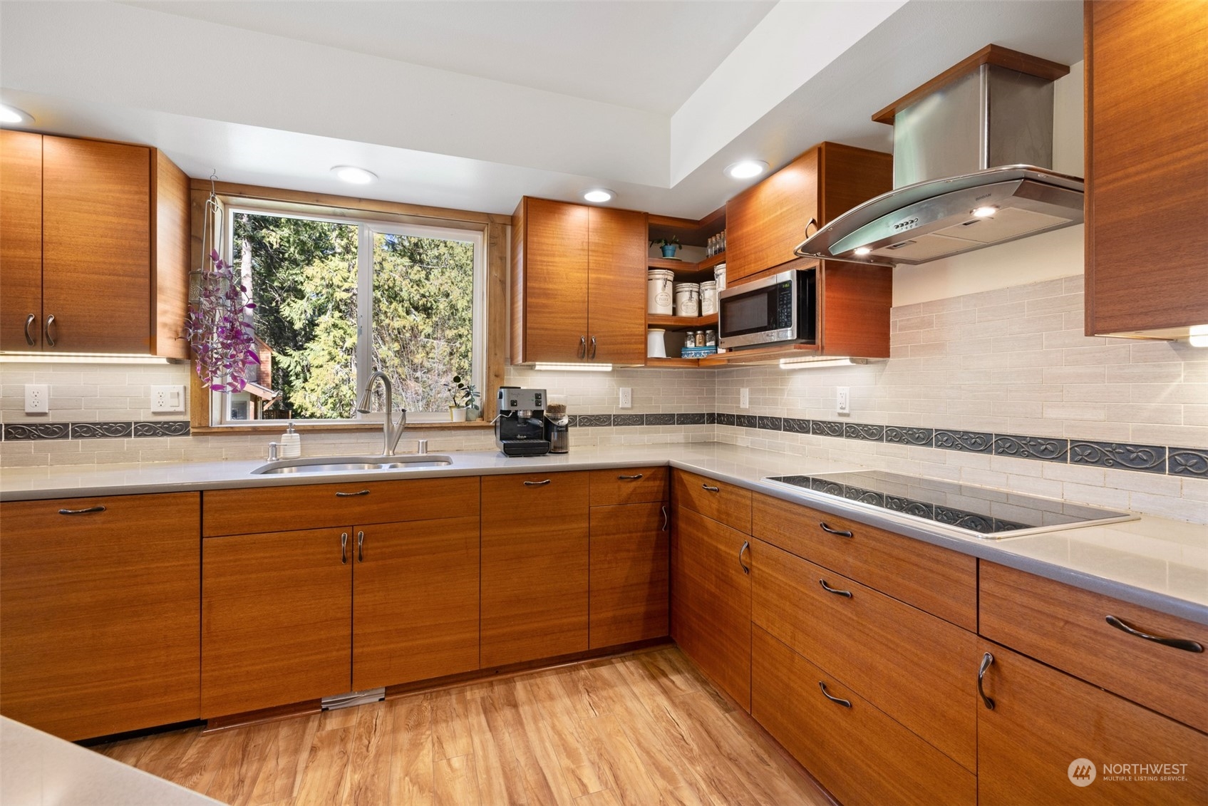 3956 Happy Valley Road Sequim, WA 98382 - Photo 16 of 40 a kitchen with stainless steel appliances granite countertop a sink a stove and cabinets