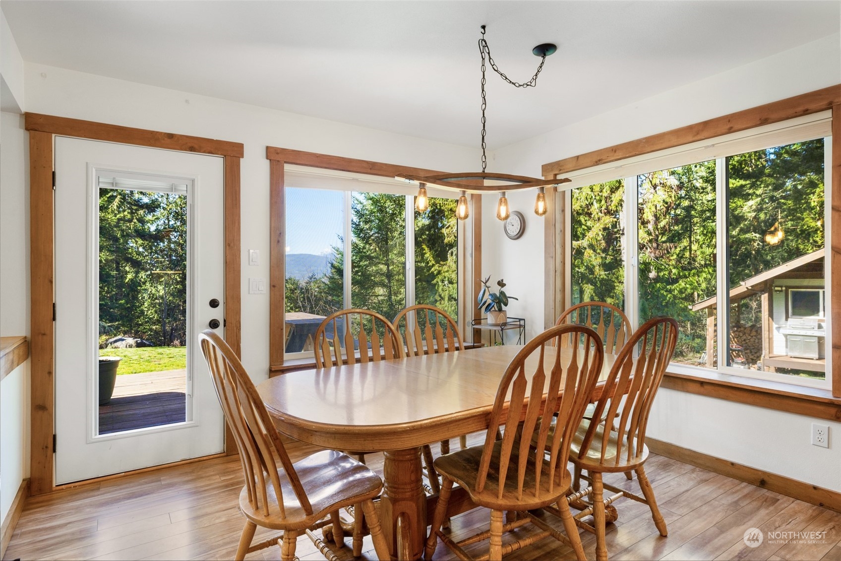 3956 Happy Valley Road Sequim, WA 98382 - Photo 20 of 40 a view of a dining room with furniture wooden floor and chandelier
