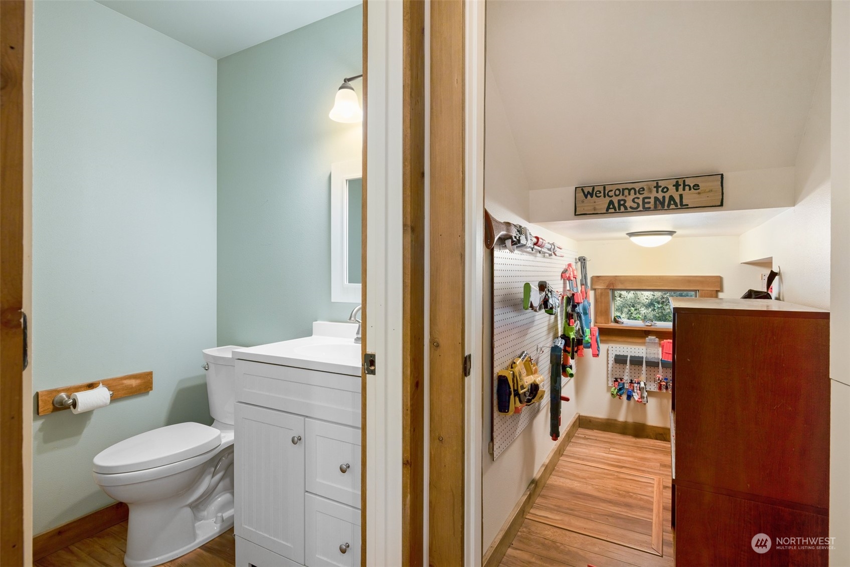 3956 Happy Valley Road Sequim, WA 98382 - Photo 25 of 40 a bathroom with a toilet a sink and a large mirror