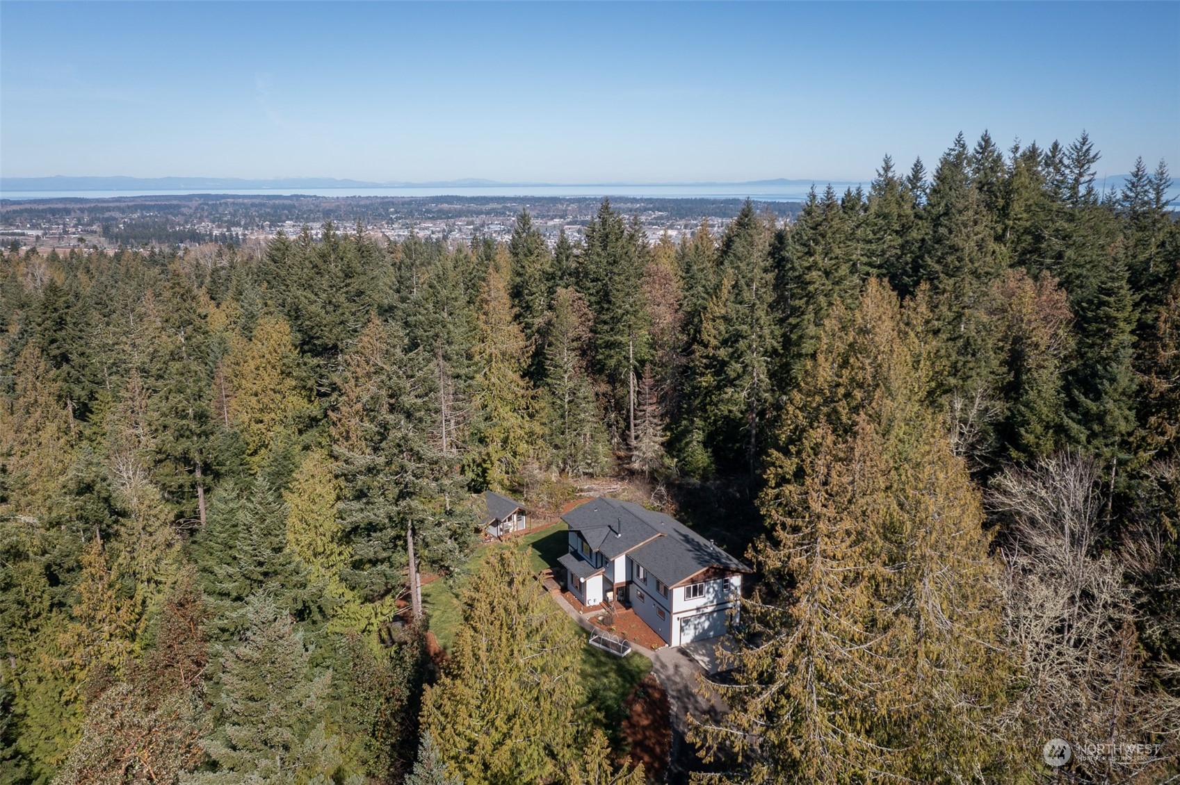 3956 Happy Valley Road Sequim, WA 98382 - Photo 3 of 40 view of a city with lush green forest